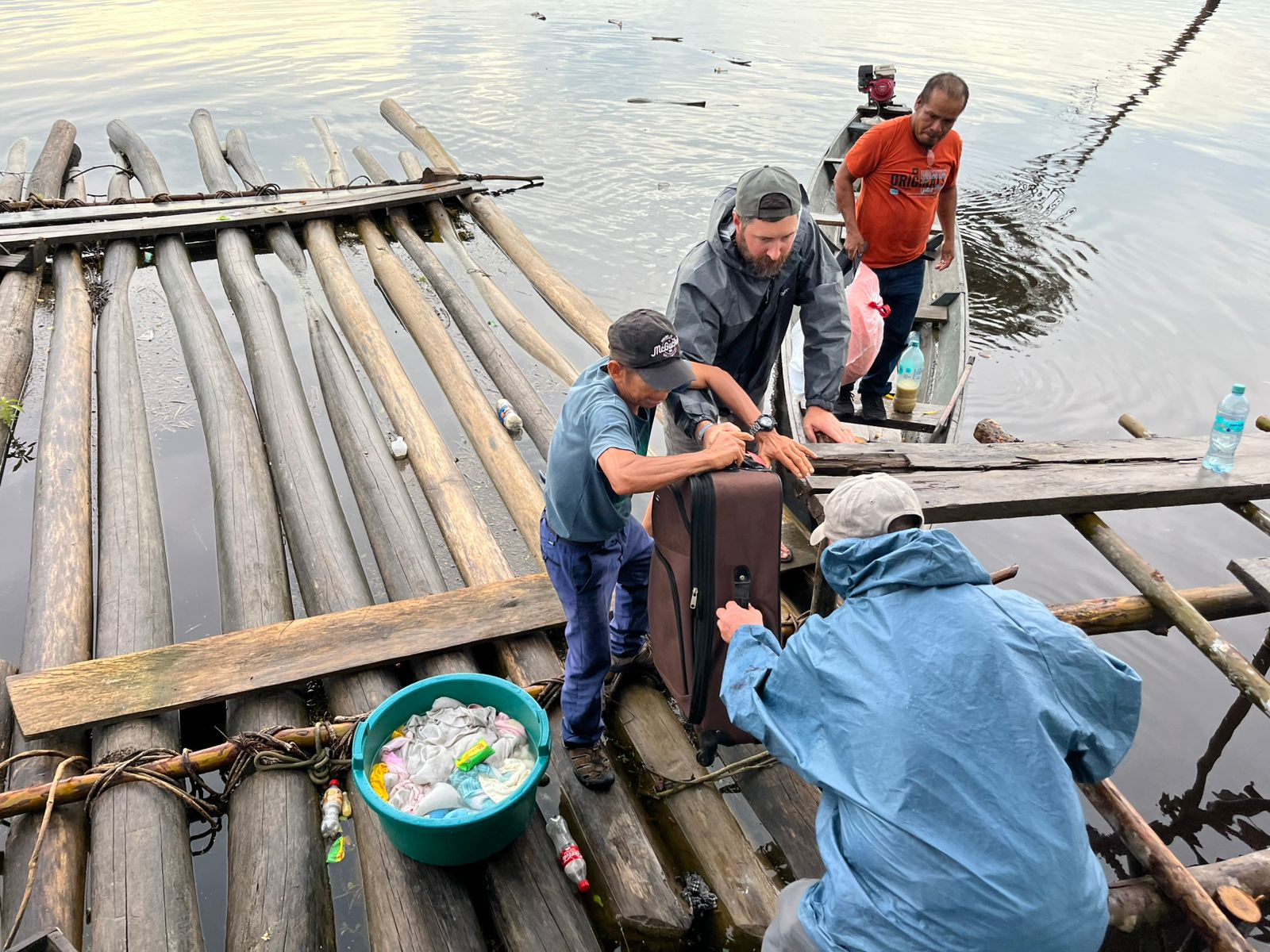 Two men sharing a meal aboard a riverboat on the Marañón