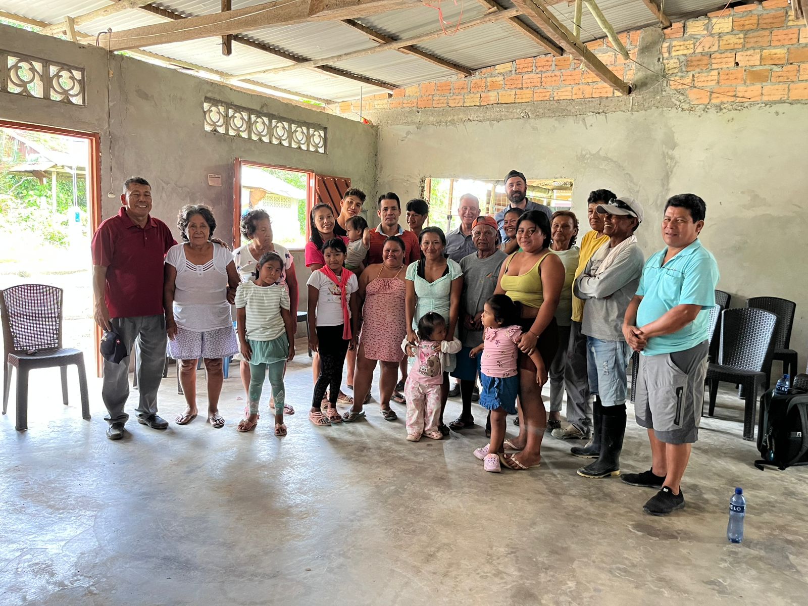 Group photo with a local riverside congregation inside their new building
