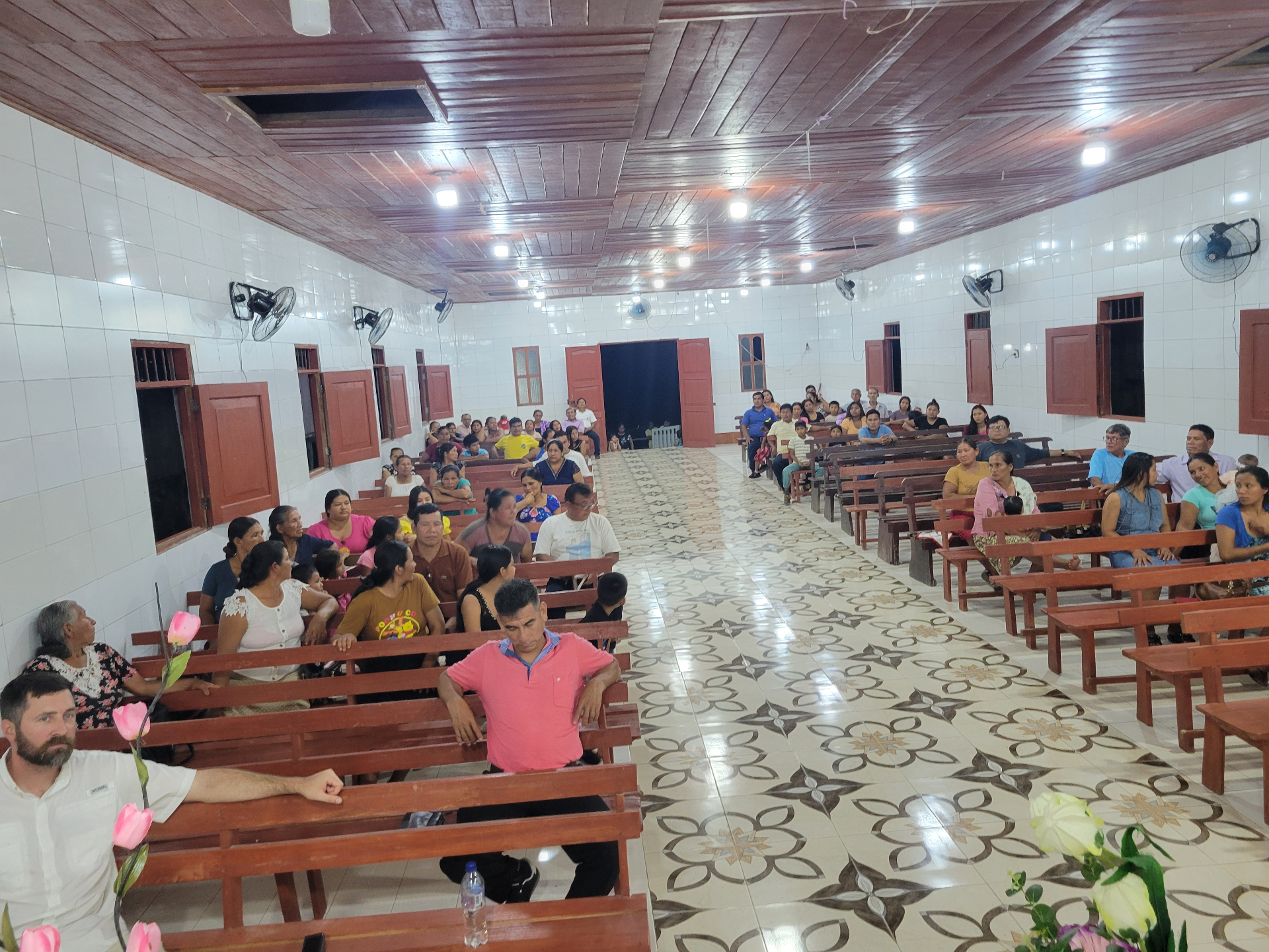 Church gathering with families seated together indoors